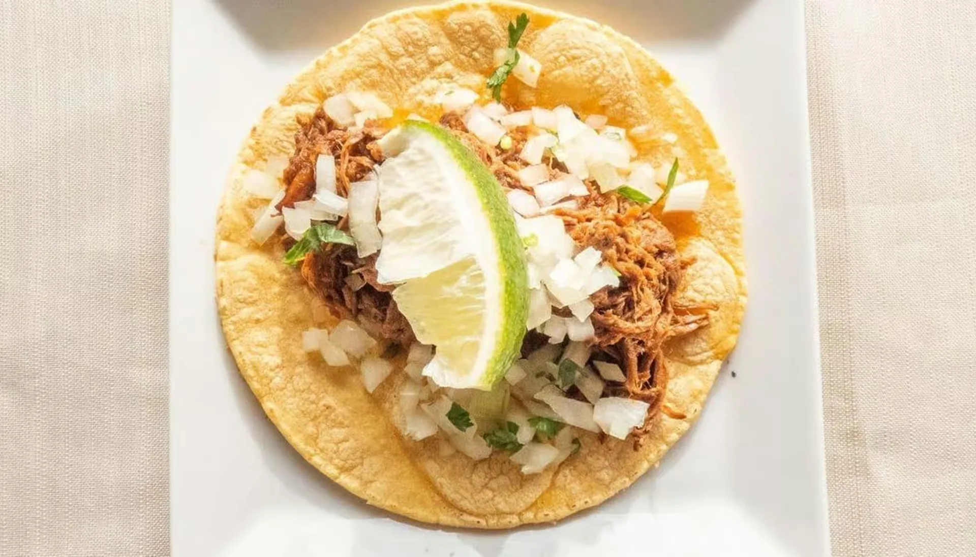 Asada beef street tacos with cilantro and onion in Winnipeg, MB